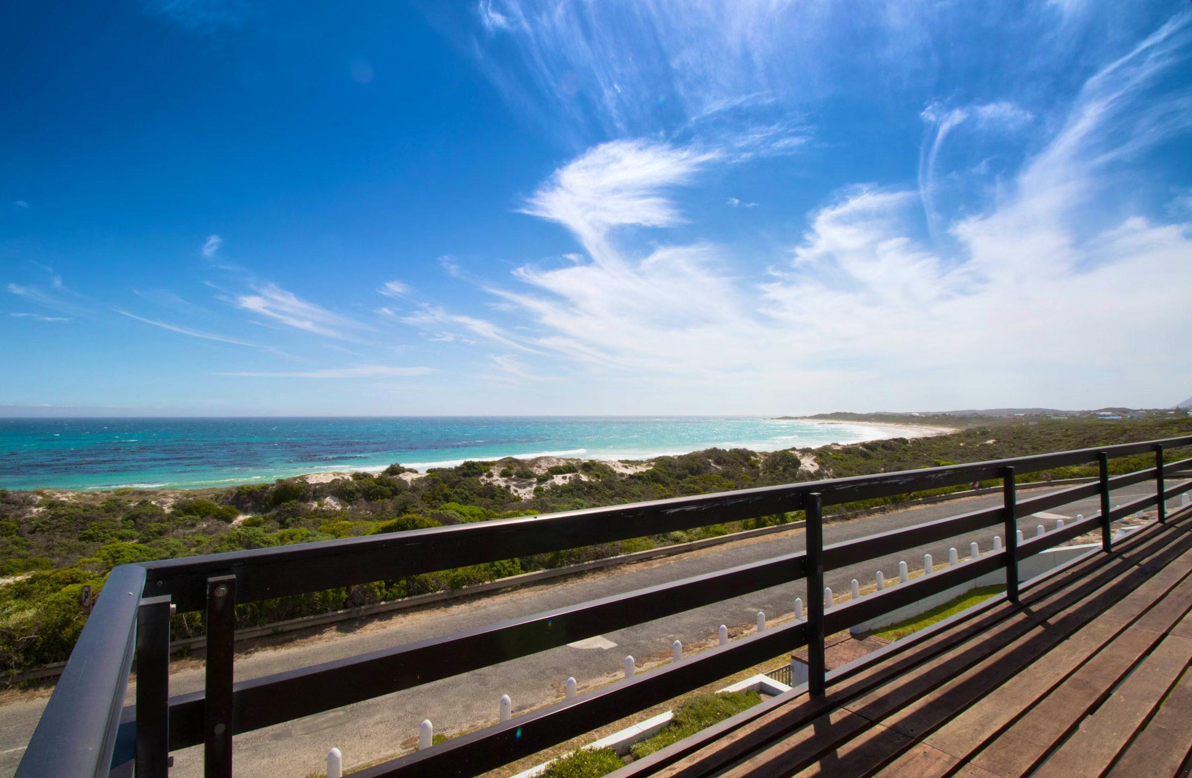 Storkereden: Sweeping turquoise beach and ocean from deck rail