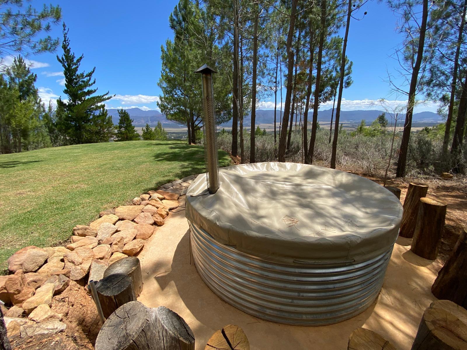 Noah Farm Campsite 4 showing the hot tub with sunny blue skies in the background