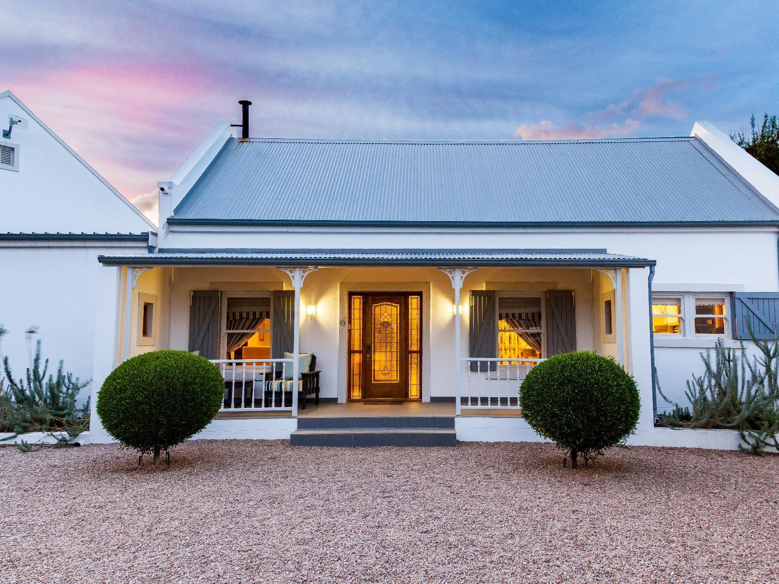 Karoo Masterclass house showing the front exterior at sunset.