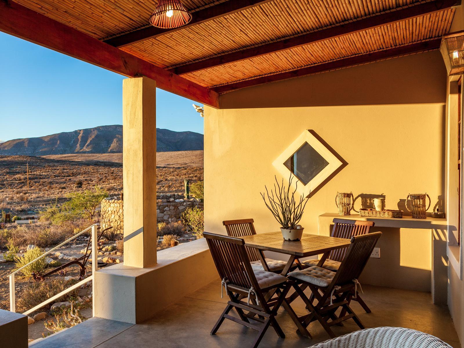 Kanon Cottage at Karoo View: outside on patio with table and chairs.