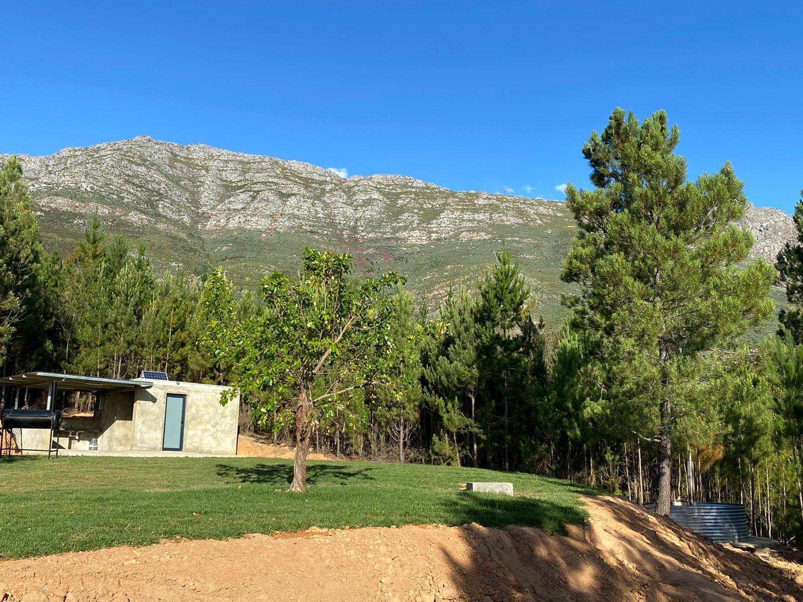 The view of the campsite and ablution with mountain views at Noah Farm Campsite 1